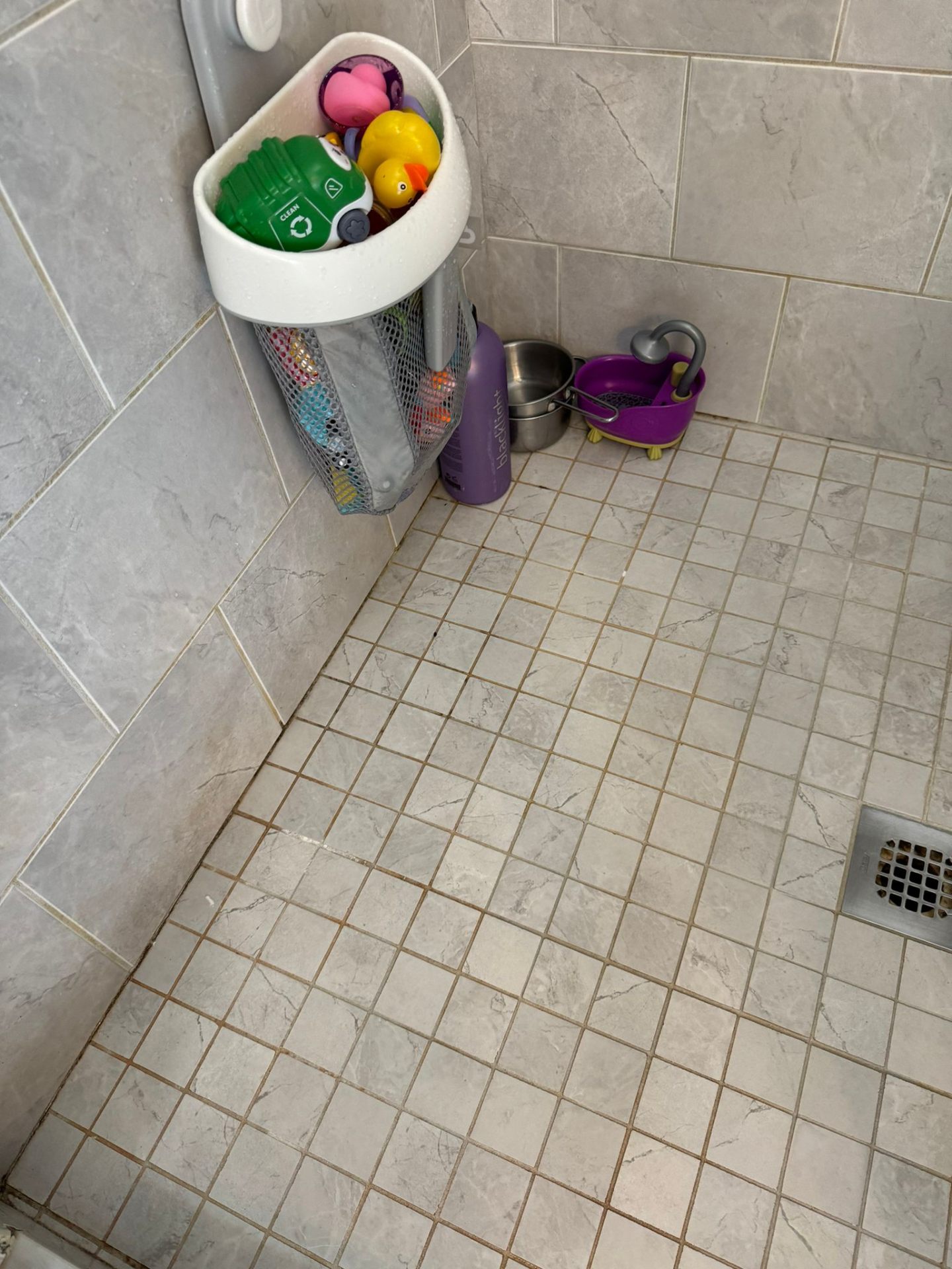 Corners and grout lines, patiently scrubbed.